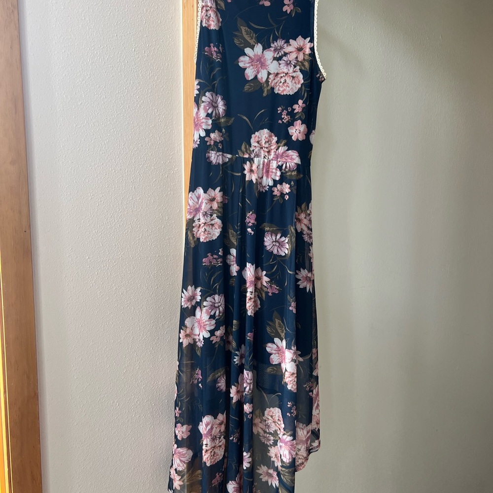Summer high front long back.  Sleeveless lace.  Great shape